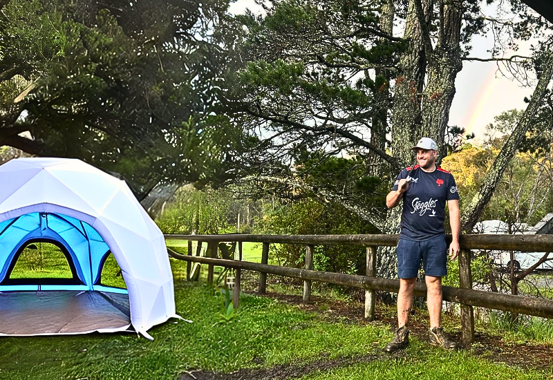 Inflatable Geodesic Dome Tent on a camping site with the Camper